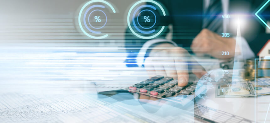 A businessman uses a calculator with financial graphs and currency in the background, representing data analysis and accounting.