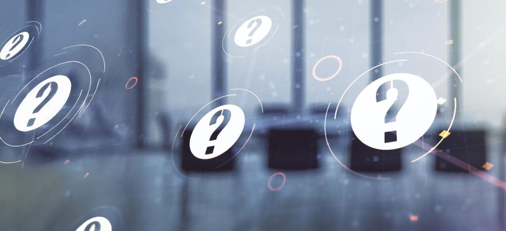 Question marks floating in a modern office space, symbolizing inquiry and curiosity in a professional environment.