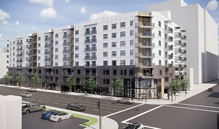 A large white apartment complex.