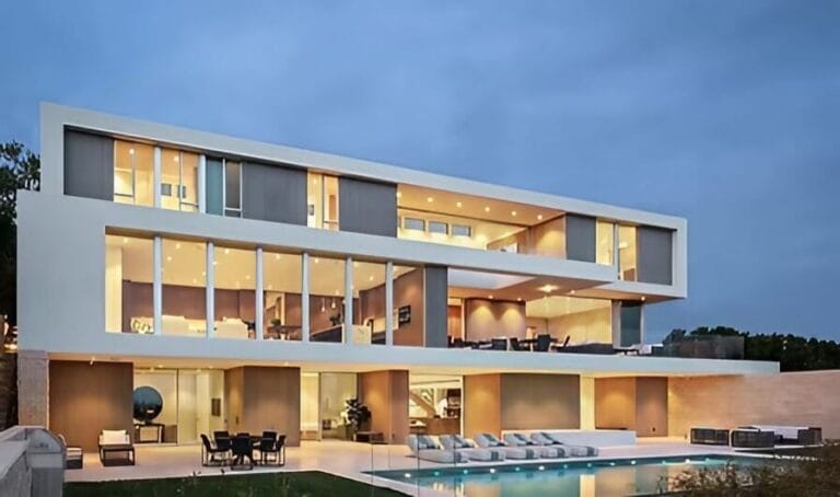 A stylish home showcasing a pool and a patio, perfect for enjoying outdoor living and entertaining.