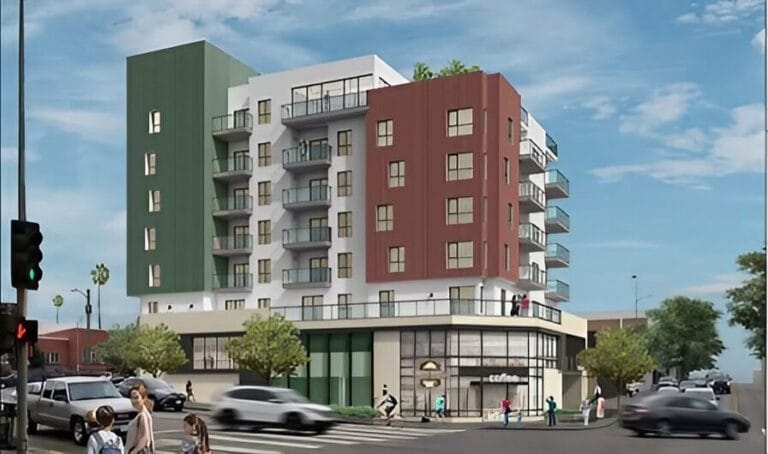 Apartment building showcasing modern design and surrounding landscape.